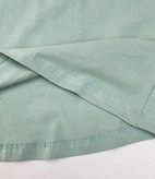 تاپ زنانه اسمارا رنگ پسته ای از پنبه ارگانیک با طراحی پشت ضربدری، مناسب استایل روزمره و تابستانی