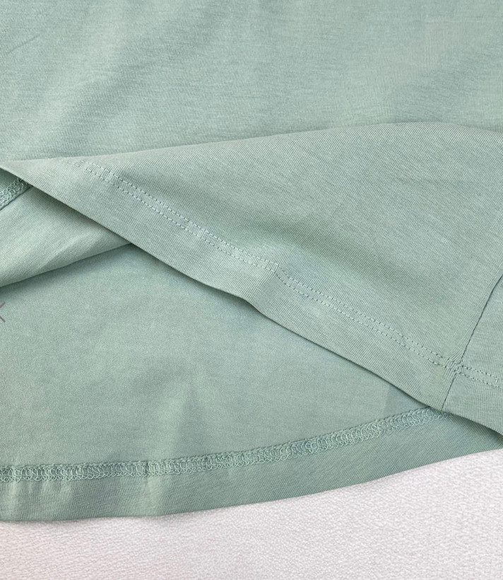 تاپ زنانه اسمارا رنگ پسته ای از پنبه ارگانیک با طراحی پشت ضربدری، مناسب استایل روزمره و تابستانی
